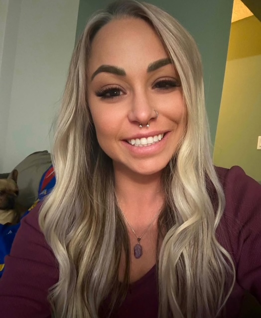 Kaley Harrison, owner of Peachy Kleen Cleaning Co., smiling warmly while providing professional residential cleaning services